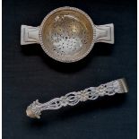 A tea strainer by Hukin & Heath Ltd, Birmingham dated 1931 together with a pair of Sterling silver