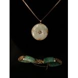 A 14k gold and jade bracelet and pendant with pendant mounted in a 9ct gold 375 chain.