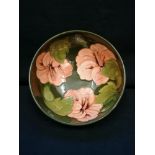 Green Moorcroft bowl of |Hibiscus| design with orange flower heads circa 1960.