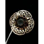 9ct Celtic style pierced brooch set with a smokey quartz. Birmingham, 1965.
