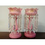 A pair of 19th century pink glass lustres complete with prismatic drops.