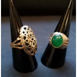 A 9ct gold dress ring together with a yellow metal and green stoned dress ring.