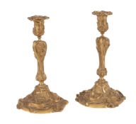 A pair of French gilt bronze candlesticks in Rococo taste