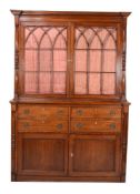 A mahogany bookcase cabinet in George III Scottish style