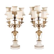 A pair of gilt metal and white marble mounted five light candelabra fitted as table lamps