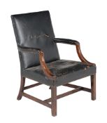 A mahogany and leather upholstered open armchair in George III style