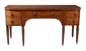 ϒ A late George III mahogany and ebony inlaid sideboard