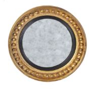 A Regency giltwood convex wall mirror