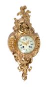 A French gilt brass cartel wall clock in Louis XVI style