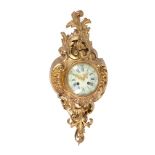 A French gilt brass cartel wall clock in Louis XVI style