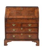 A George II walnut and cross banded bureau