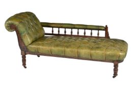 A late Victorian walnut and green leather button upholstered chaise longue