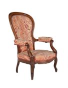 A Victorian walnut and upholstered reclining armchair