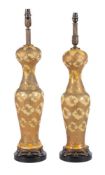 A pair of opaque yellow glass and gilt metal mounted table lamps