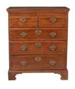 A George III oak and mahogany crossbanded chest of drawers