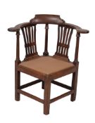 A George III mahogany corner armchair