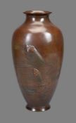 A Japanese Bronze Vase of tapered ovoid form resting on a splayed foot and rising to a short