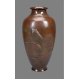 A Japanese Bronze Vase of tapered ovoid form resting on a splayed foot and rising to a short
