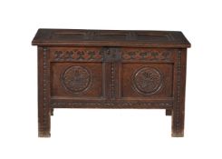 A carved oak coffer