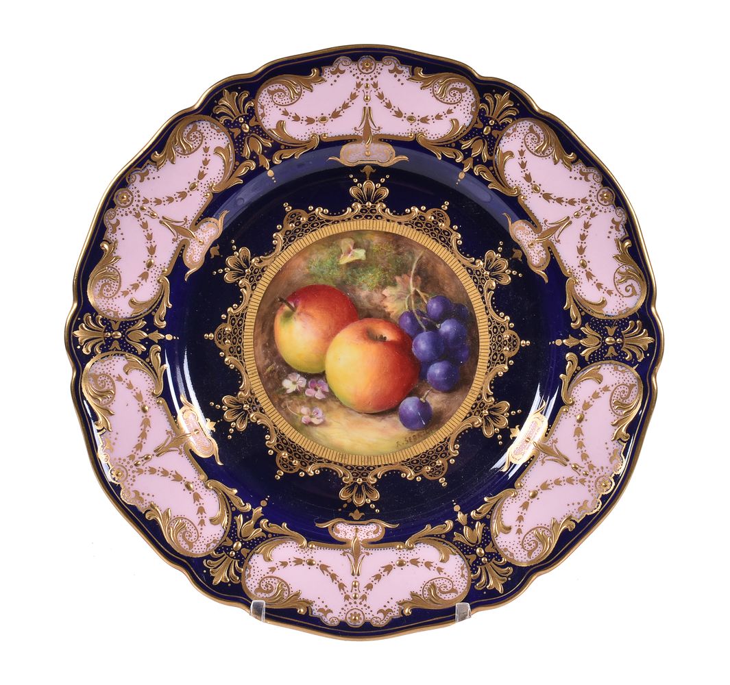 A Royal Worcester dessert plate painted with autumnal windfall fruit by R. Seabright