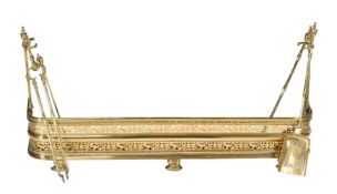 A late Victorian or Edwardian pierced brass fender