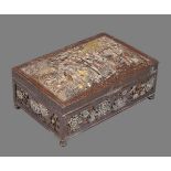 A Japanese Bronze Overlaid Box of rectangular form raised on four bun feet and with hinged cover