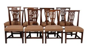 A harlequin set of eight mahogany dining chairs in George III style