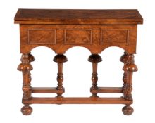 A figured walnut and feather banded tea or side table in William & Mary style