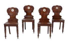 A set of four Regency mahogany hall chairs
