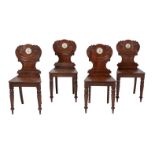 A set of four Regency mahogany hall chairs