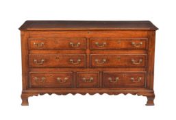 A George III oak and mahogany cross banded mule chest