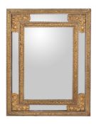 A painted and parcel gilt wall mirror in mid-17th century style