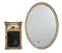 A George III giltwood oval wall mirror