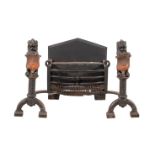 A Victorian wrought and cast iron and copper mounted fire grate