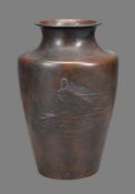 A Japanese Bronze Vase of tapered form with an angular shoulder and cylindrical neck with everted