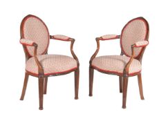 A pair of carved mahogany and upholstered fauteuils in Louis XV style