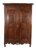 A French carved walnut armoire