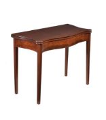 A George III figured and plum pudding mahogany serpentine tea table