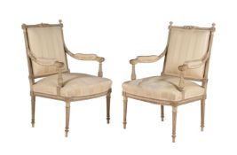 A pair of painted fauteuils in French transitional style