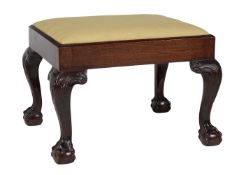 A mahogany and upholstered stool in George II style