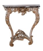 A carved giltwood and marble topped console table