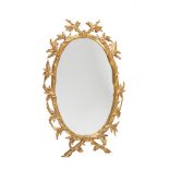 A gilt composition oval wall mirror in George III style
