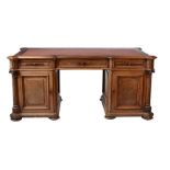 A Continental walnut twin pedestal desk