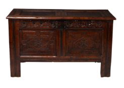 A carved oak coffer