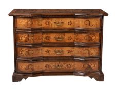 A Continental walnut and marquetry inlaid commode