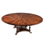 A flame mahogany extending dining table in William IV style