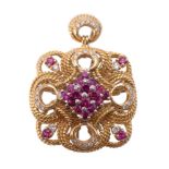 A ruby and diamond pendant