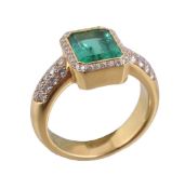 An emerald and diamond ring