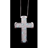 A diamond and turquoise cross pendant