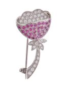 A diamond and pink sapphire brooch